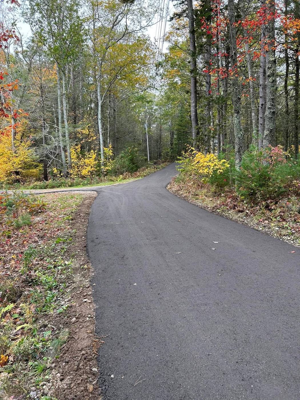 Reclaimed and freshly paved road